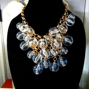 Beautiful 10 inch gold chain and clear balls with matching earrings.